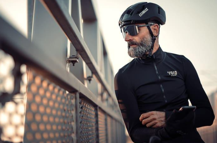 A guy in sunglasses and a black top, showcasing Bliz Hero Black Sport Sportglasses