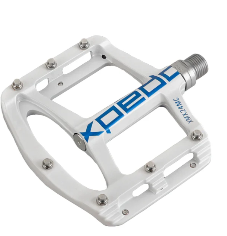 Close-up of Xpedo SPRY pedal showing low-profile 11mm design and grip pins