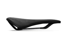 Top-down view of the Novus Boost Evo Superflow saddle, highlighting the waved shape and central cutout for pressure relief.