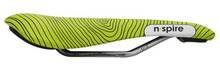 Bicycle saddle featuring a green stripe, labeled as Smanie Nspire Saddle in a sleek design