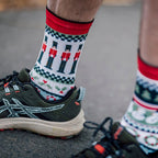 Holiday themed sports socks with nutcracker and candy cane design