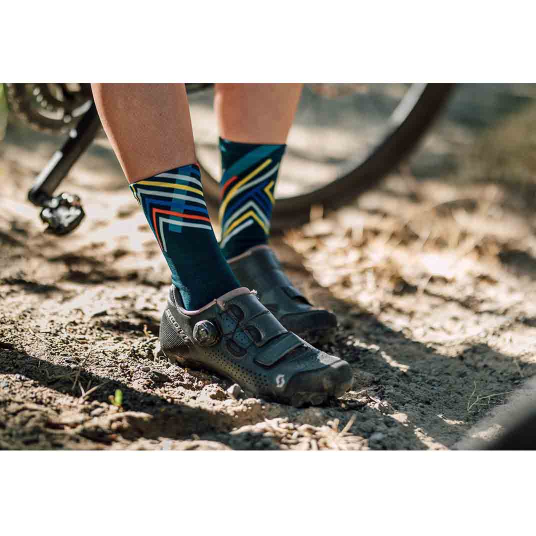 Teal Sox Performance crew socks with orange stripes