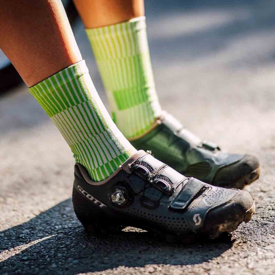 Lightweight green athletic crew socks with breathable mesh fabric