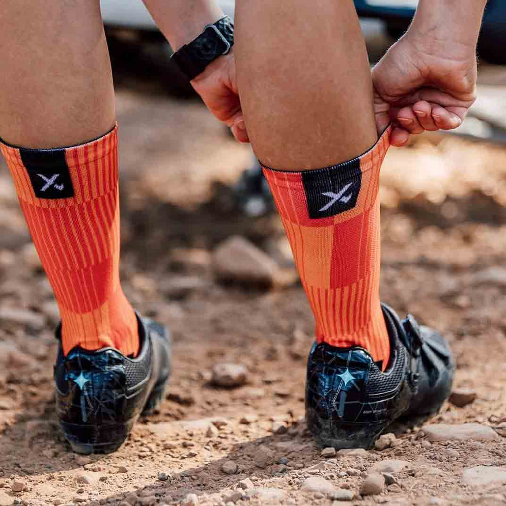Orange performance crew socks with seamless toe and reinforced heel