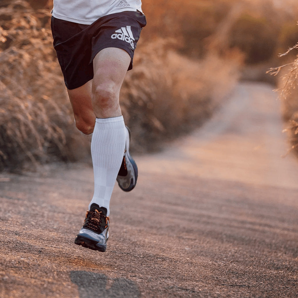 White knee high compression socks with breathable mesh