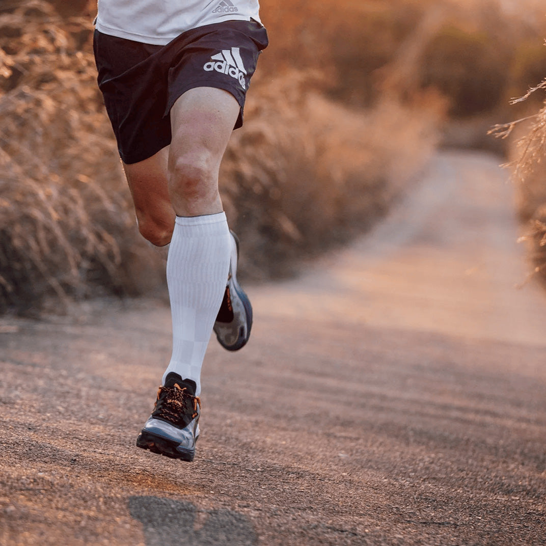 White knee high compression socks with breathable mesh