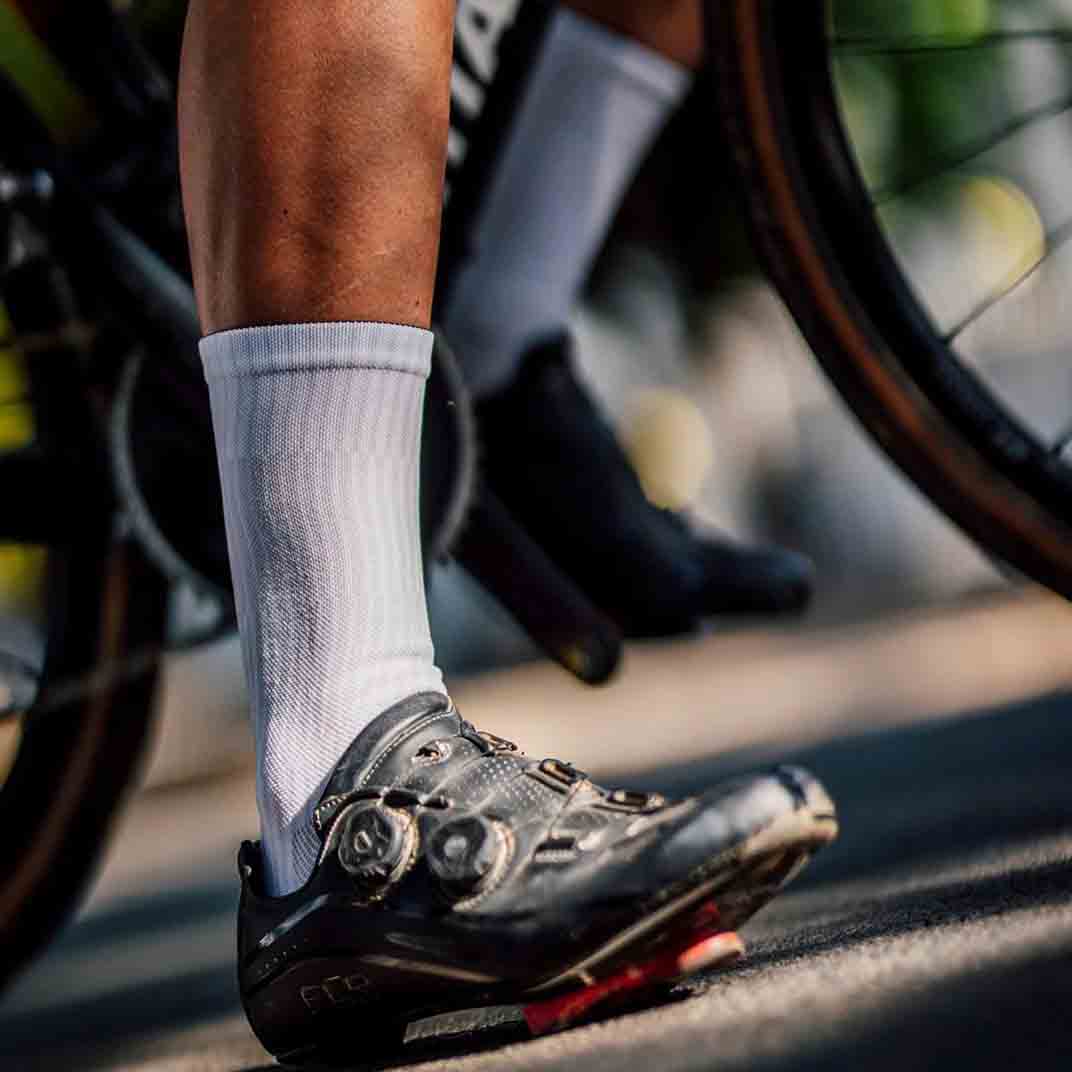 Lightweight white athletic crew socks with breathable mesh fabric