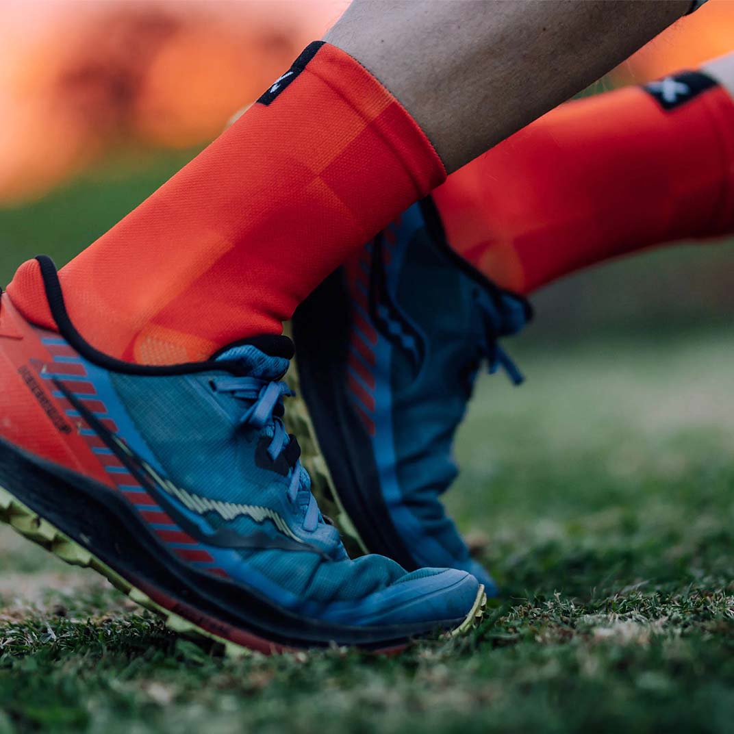 Lightweight orange crew socks with breathable mesh fabric