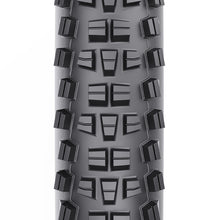 The WTB Trail Boss 27.5x2.25 tire, featuring a tread pattern that provides excellent braking traction and cornering grip.