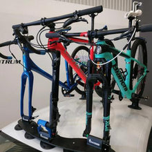 A car equipped with a roof rack carrying three bicycles, showcasing versatility for outdoor adventures and cycling trips.