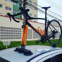  A bicycle mounted on a car roof rack, featuring the TreeFrog Elite 1 Bike Rack, ideal for road and gravel biking