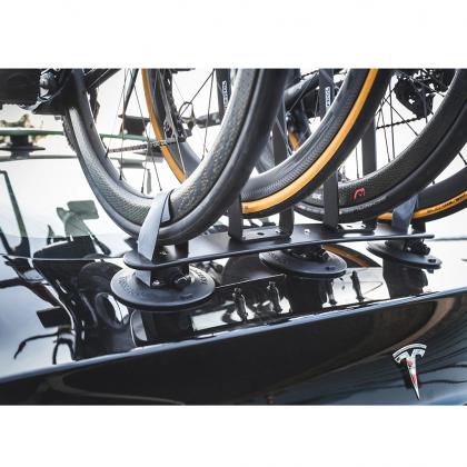 A car featuring a bike mounted on its roof with a TreeFrog L2 Front Wheel Holder for secure transport