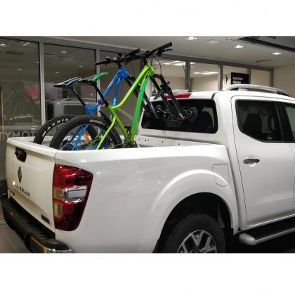 Pickup truck carrying two mountain bikes using the TreeFrog Pro 2 Bike Rack