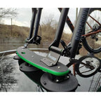 TreeFrog Pro 2 Plus Bike Rack Close-Up on Car: A detailed view of the TreeFrog Pro 2 Plus suction cup bike rack mounted on a car roof, holding a bike by its fork mount.