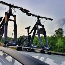  Two bikes on a car's roof rack, highlighting the TreeFrog Pro 3 Bike Rack, perfect for road and mountain biking adventures.

