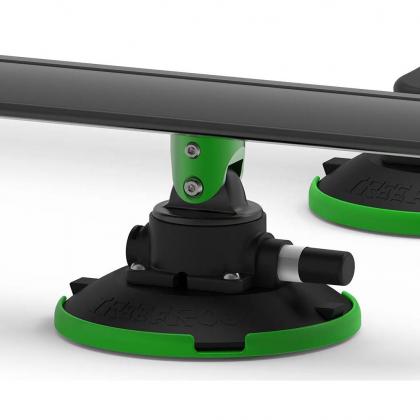  Two green and black plastic mounts for a camera, designed for TREEFROG roof rack crossbars in black.
