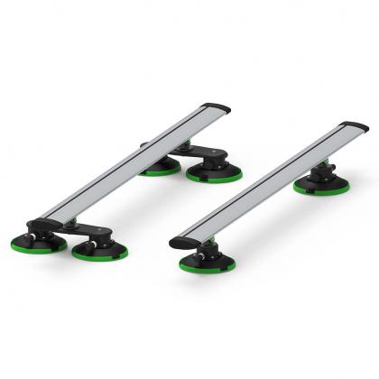 Two green and black car racks with black wheels, featuring TREEFROG ROOF RACK CROSSBARS in silver
