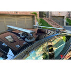 Silver TREEFROG roof rack crossbars mounted on a car's roof, ready for adventure and extra cargo space