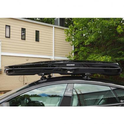 A car featuring a silver Treefrog roof rack crossbar on top, ready for adventure and extra cargo.