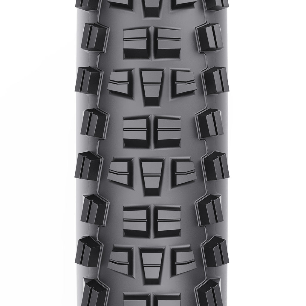 A product photo of the WTB Trail Boss 29-inch tire, showing the generous spacing between knobs for traction in loose or wet conditions.