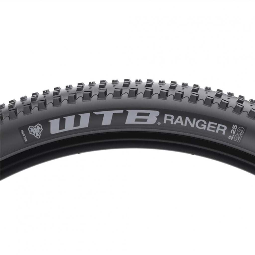 Close-up of the Ranger Comp 29x2.25 tire, showing the tightly spaced center knobs and open outer lugs for superior grip on trails.