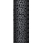 A close-up of the WTB Riddler tire, showing its light/fast rolling tread pattern and classic tanwall finish.

