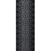 A close-up of the WTB Riddler tire, showing its light/fast rolling tread pattern and classic tanwall finish.

