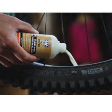 WTB TCS Tubeless Tire Sealant with a focus on the bottle's label, detailing its volume and purpose.

