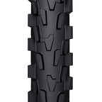 A top-down close-up of the WTB VelociRaptor Front tire, showing its specific tread pattern with directional, angled knobs.

