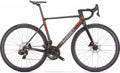 Specialized black and orange Wilier Verticale SLR carbon fiber road bike frameset showcased prominently.