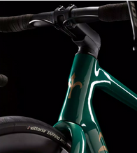 Green Wilier Garda Disc carbon road bike with a black handlebar, designed for endurance cycling.
