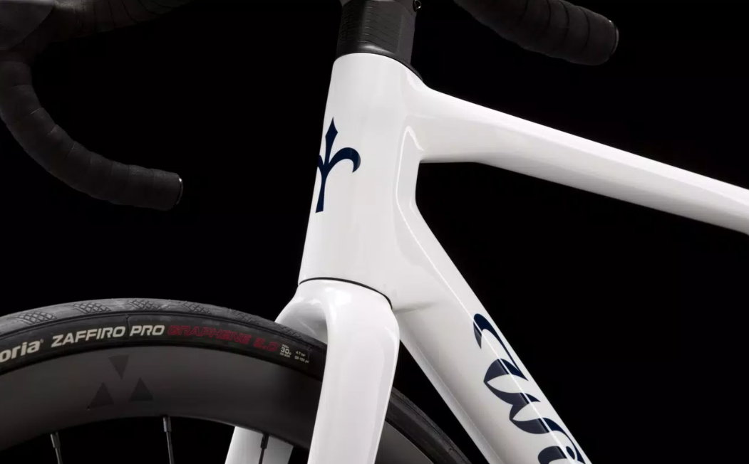 Close-up of a white Wilier Granturismo SL carbon fiber bike featuring it's logo, designed for endurance cycling.