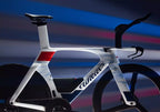 Wilier Supersonica SLR triathlon bike with white, red, and blue accents, showcasing its aerodynamic frame.