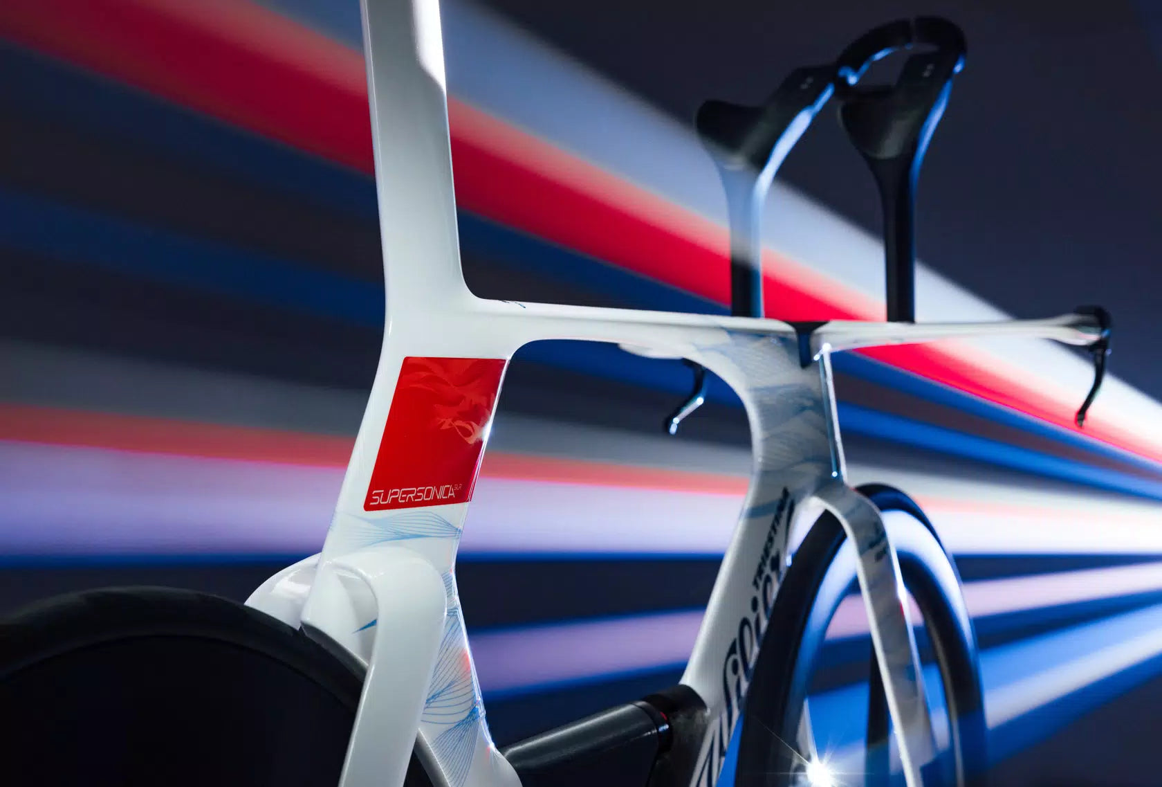 Close-up on the sculpted aerodynamic tubes of the Wilier Supersonica SLR frameset, showcasing the sophisticated engineering for minimal drag.
