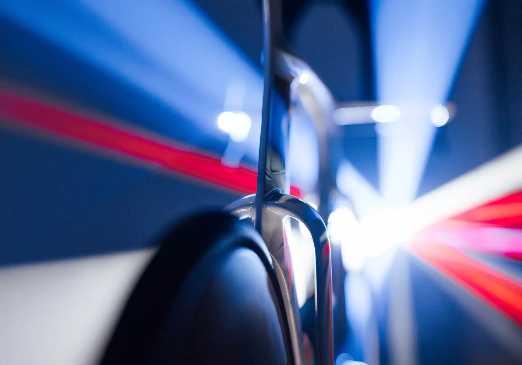 Close-up detail of the Wilier Supersonica SLR's cockpit, highlighting the integrated Profile Design ASC Pro Extensions and their ergonomic aero shaping.