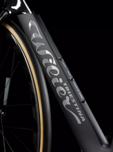 Close-up view of the Wilier Turbine SLR frameset, highlighting the intricate carbon fiber weave and construction.