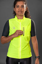 Man wearing Neon colored Gilet Sleeveless Cycling Jacket, showcasing front pocket