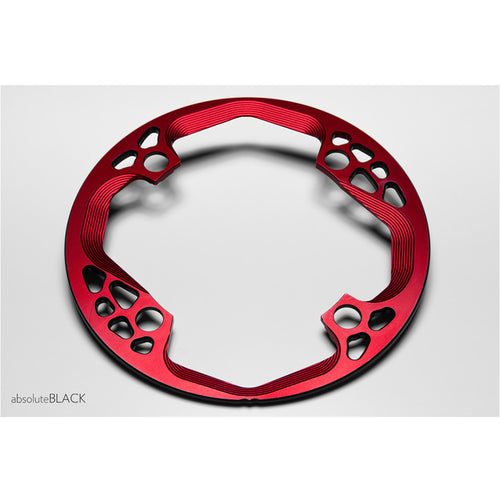 Angled view of the red Absolute Black Bashring 104BCD showing its machined profile.