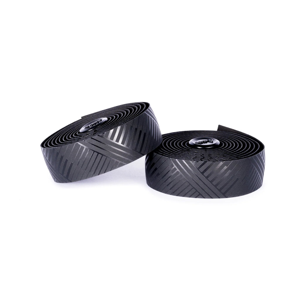 A roll of GUEE eco-friendly Attitude bartape in Tracer Matt Black, emphasizing its sustainable production process and high-end feel.

