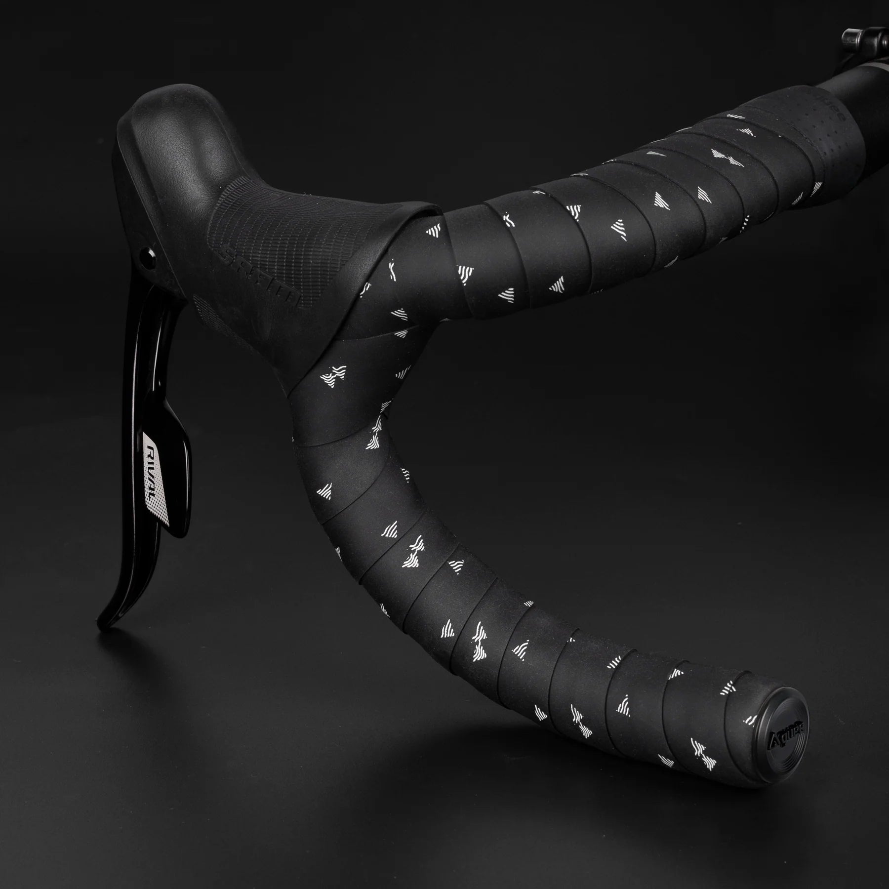 A roll of GUEE eco-friendly Attitude bartape in Styled White, emphasizing its sustainable production process and high-end feel.

