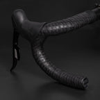 Close-up of GUEE Tornado Black handlebar tape, showcasing the texture for enhanced hand support and comfortable grip.

