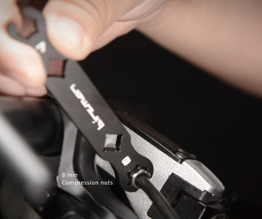 Illustration of the Birzman Flare Nut Wrench engaging a hydraulic brake fitting slot.