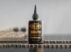Blub Graph 120ml lubricant bottle standing upright on a bicycle chain.