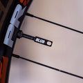 Blub tubeless valve installed on a bicycle rim, close-up view of the valve stem and locknut.