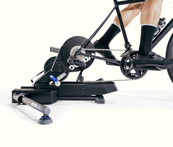 Detailed view of the Wahoo KICKR MOVE's adjustable AXIS feet, which allow for natural side-to-side movement and improved comfort.