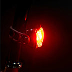 Lezyne Zecto Drive Max 400+ Rear Light attached to a handlebar loop