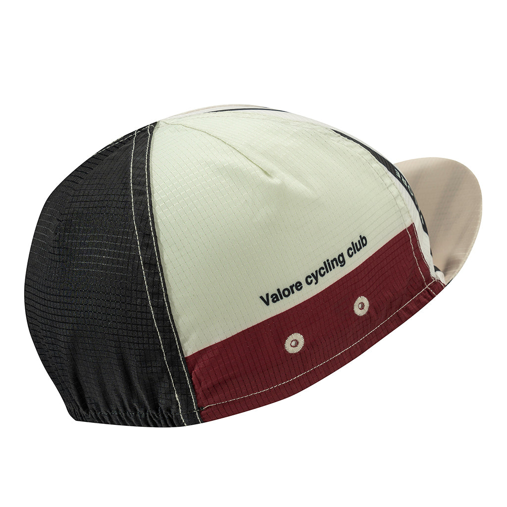 Monton Valore Linea Arte cycling cap in Stone Blue folded flat, showing the one-size adjustable fit.