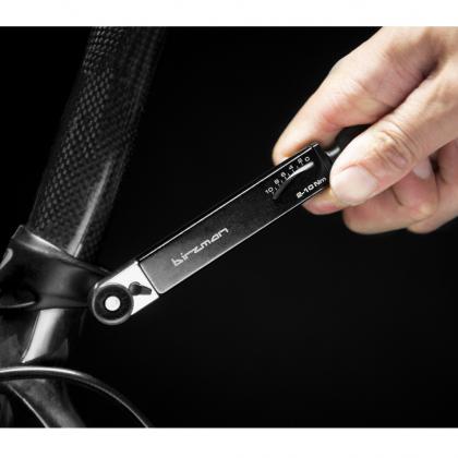 A close-up of the Birzman Pocket Torque Wrench, highlighting its compact size and use for accurate bolt tightening.