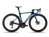 Polygon Helios A8X aero road bike with disc brakes and deep-section wheels, presented against a dark checkered background.