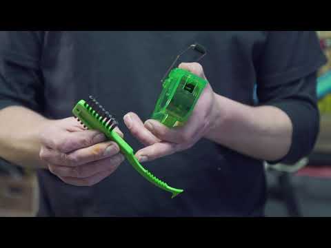 A dedicated Juice Lubes cassette brush, essential for thoroughly cleaning bicycle rear cogs and maintaining drivetrain performance.